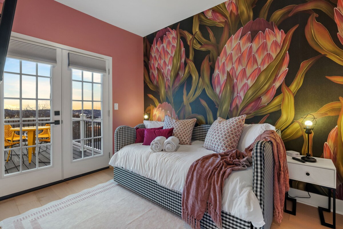 130 Prospect Street · Bedroom with floral walls and deck access